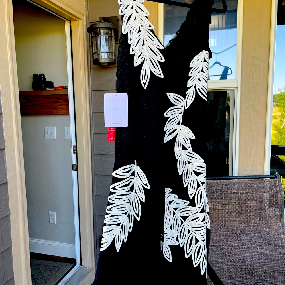 Classy Black sleeveless dress with embroidery embellishments. NWT.